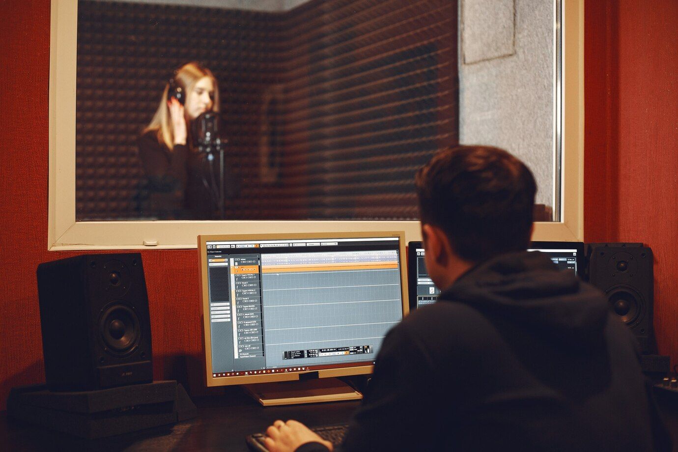 radio-host-gesturing-while-recording-podcast-radio-studio_1157-47781.jpg